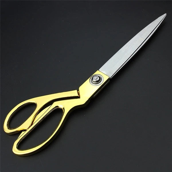 Sharp stainless steel tailoring scissors for professional use.