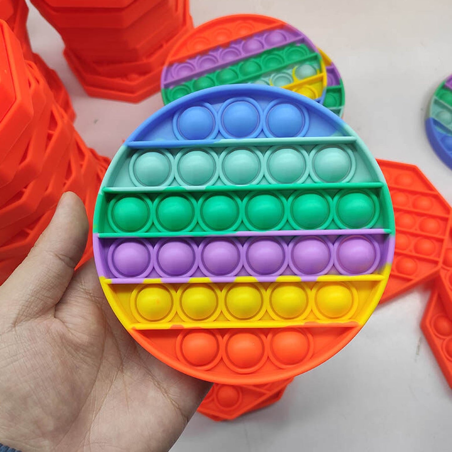 Colorful round pop it toy.