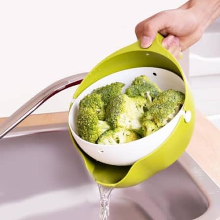 Strainer bowl with handle for easy washing of fruits and vegetables.