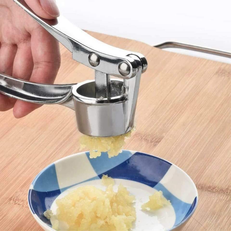 Garlic press with stainless steel construction and ergonomic handle