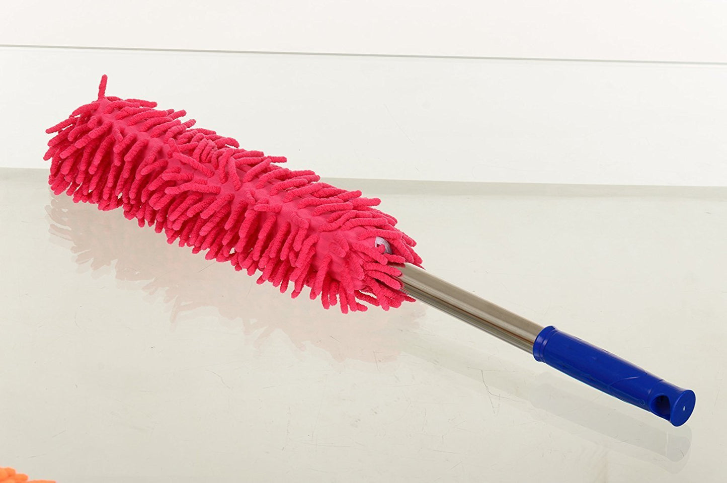 Telescopic cleaning duster with microfiber for efficient dusting.