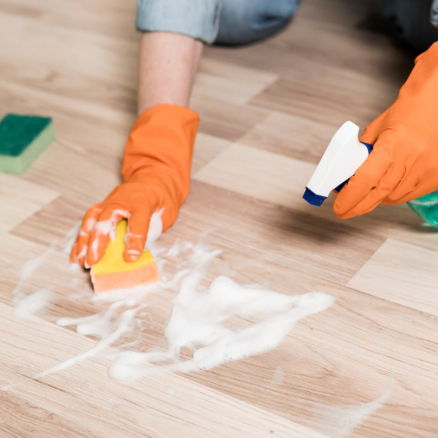 Orange gloves suitable for cleaning tasks