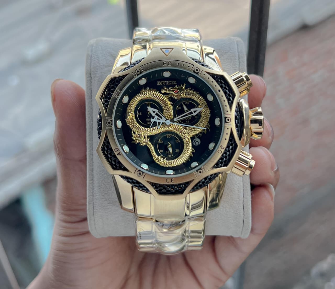 Invicta venome luxury chronograph watch, featuring a striking gold dial with a detailed snake design,