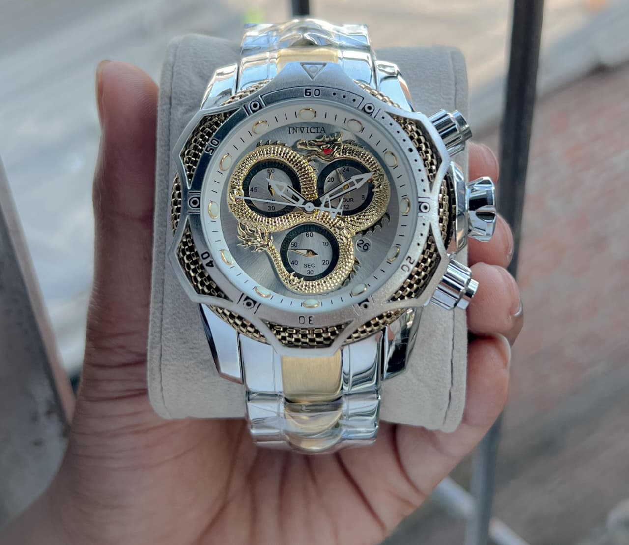 Invicta venome luxury chronograph watch, featuring a striking gold dial with a detailed snake design,