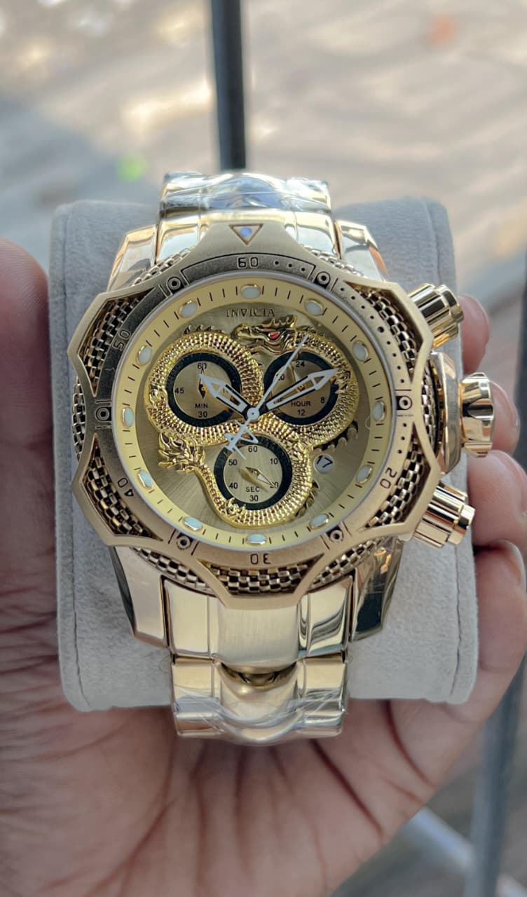 Invicta venome luxury chronograph watch, featuring a striking gold dial with a detailed snake design,