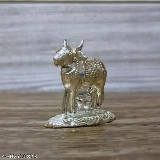 German Silver Kamadhenu Cow And Calf Idol For Pooja / Decor Height : 1.5 Inches Weight : 11 Grams