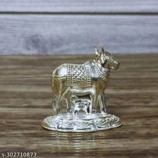 German Silver Kamadhenu Cow And Calf Idol For Pooja / Decor Height : 1.5 Inches Weight : 11 Grams