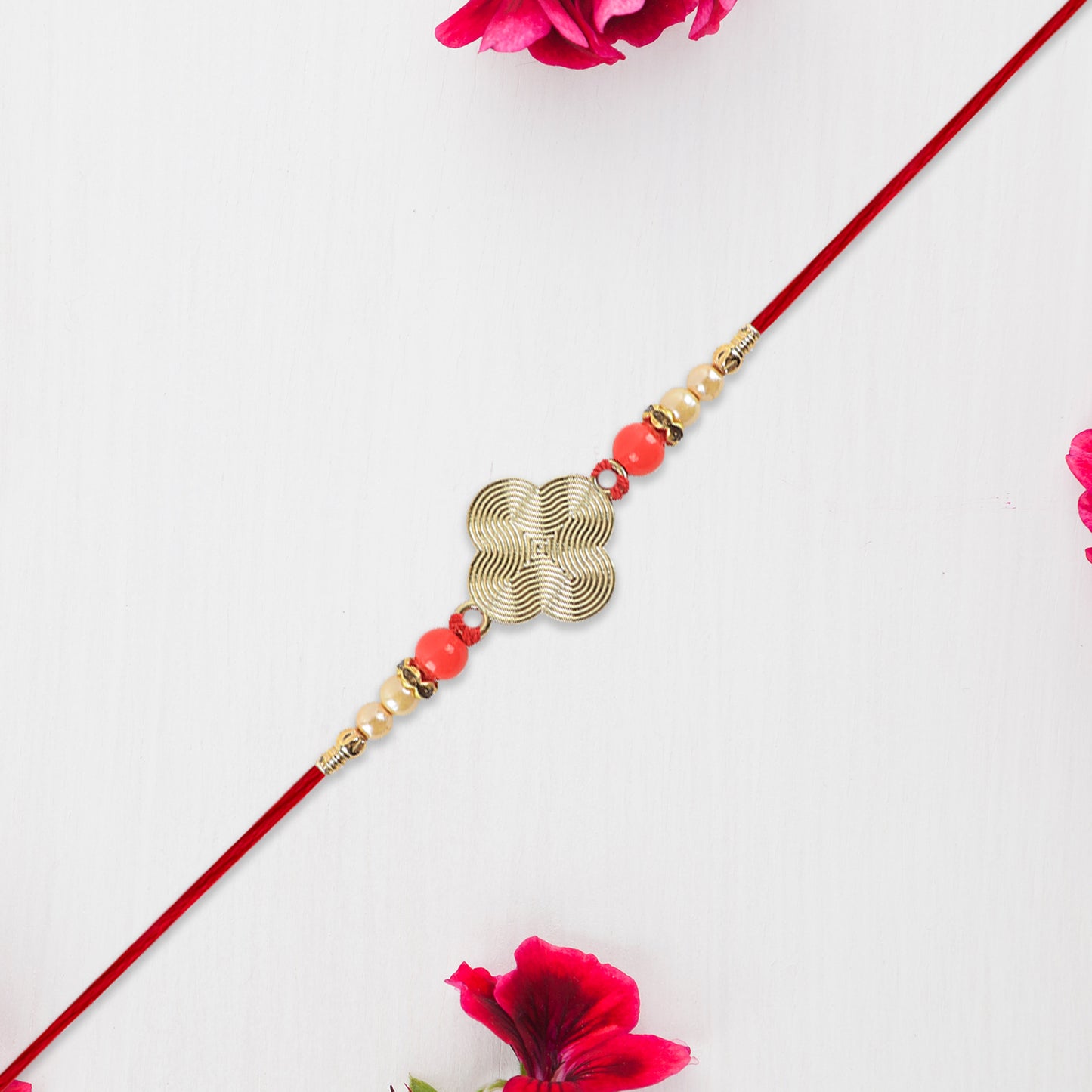 Rakhi With Multicolor Beads  Silver Accents On Red Thread
