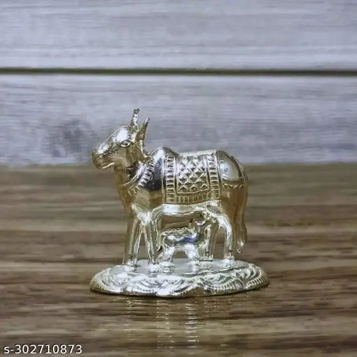 German Silver Kamadhenu Cow And Calf Idol For Pooja / Decor Height : 1.5 Inches Weight : 11 Grams