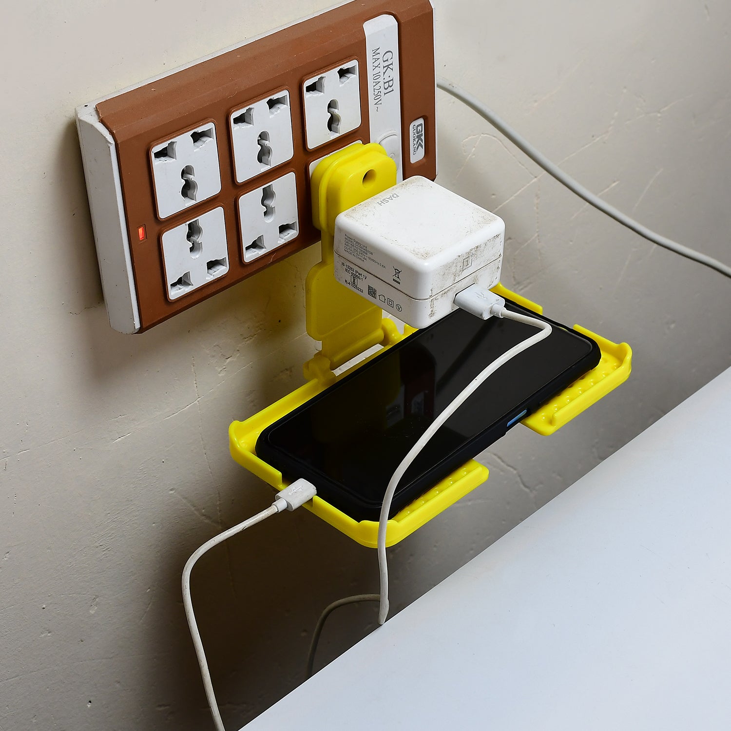 6498 Multi-purpose Wall Holder Stand For Charging Mobile Just Fit In Socket And Hang (Yellow) - Springkart 